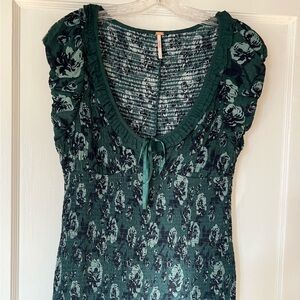 Free People Dress. Low neck for sex appeal. Ruched stretch = s or m. Worn once.